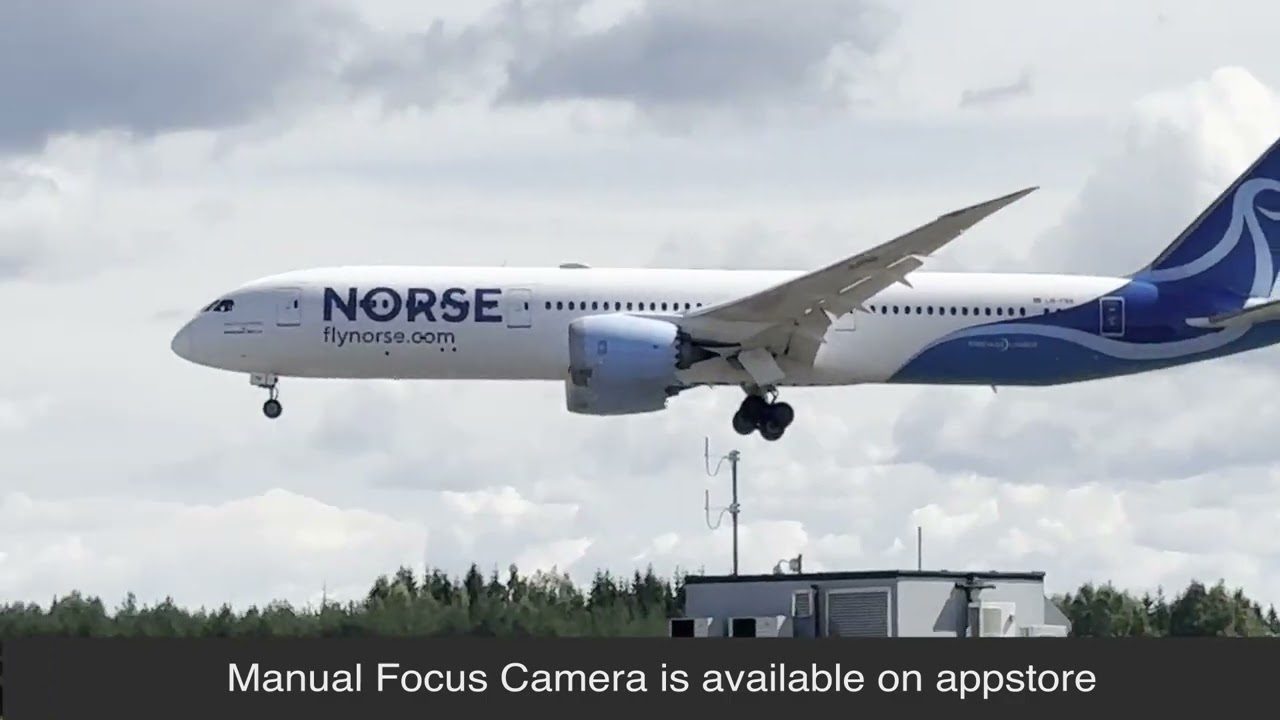 A Norse Atlantic Boeing 787 on final approach, sharp against cloud, filmed on an iPhone with Manual Focus Camera